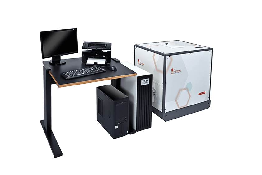 Anasazi Instruments 60 MHz NMR spectrometers near desk with computer equipment