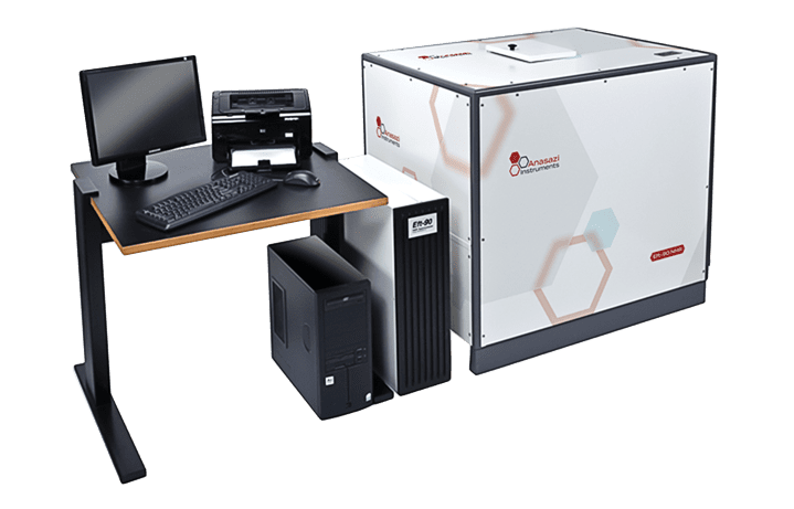 Anasazi Instruments 90 MHz NMR spectrometers near desk with computer equipment